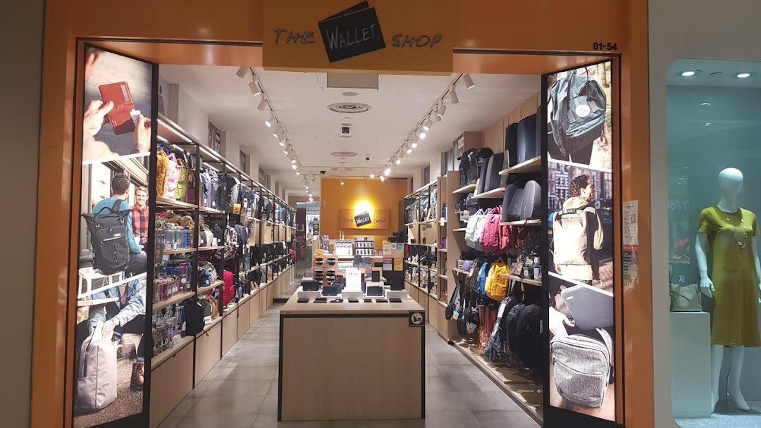 Entrance of The Wallet Shop displaying bags and wallets from a mall corridor.