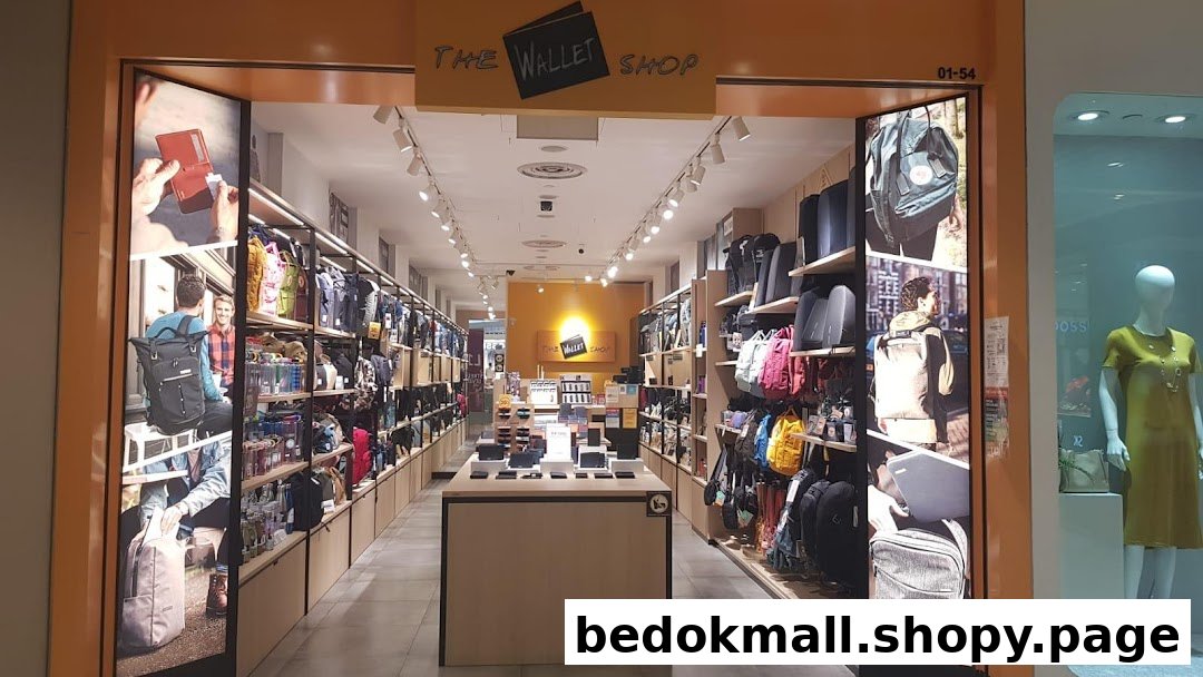 Entrance of The Wallet Shop displaying bags and wallets from a mall corridor.