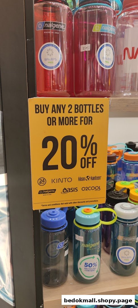 Water bottles on display with a 20% off promotion sign.