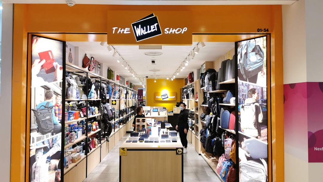 Shop entrance with visible interior displaying wallets and bags.