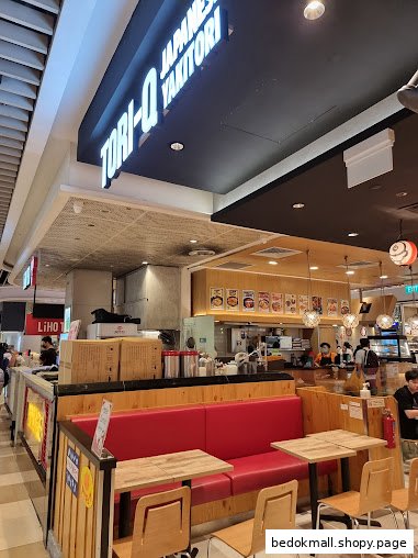 Interior view of Tori-Q Japanese Yakitori shop with seating and counter.