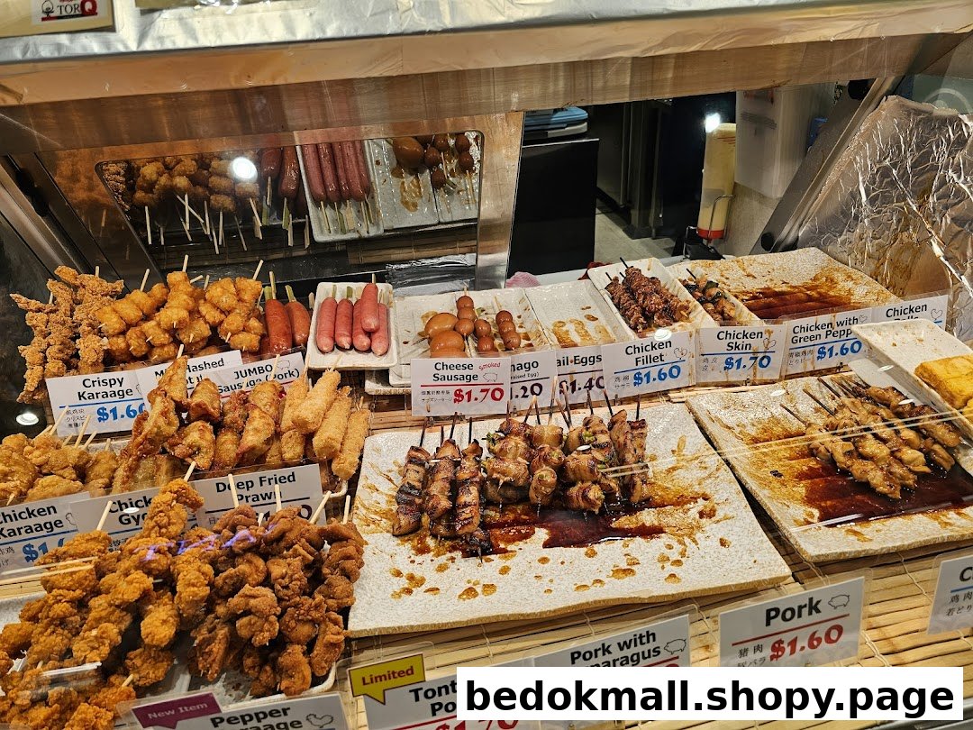 Display case filled with various skewered and fried food items with price tags.