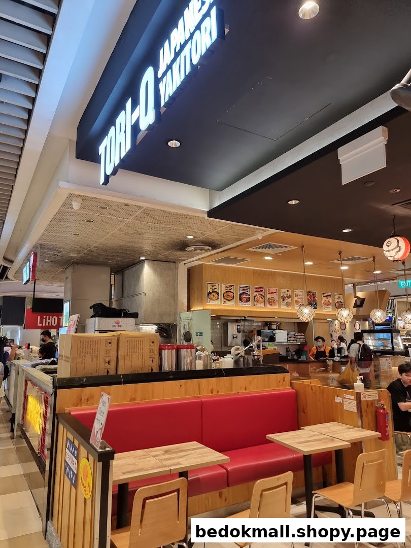 Interior view of Tori-Q with seating, counter, and shop sign.