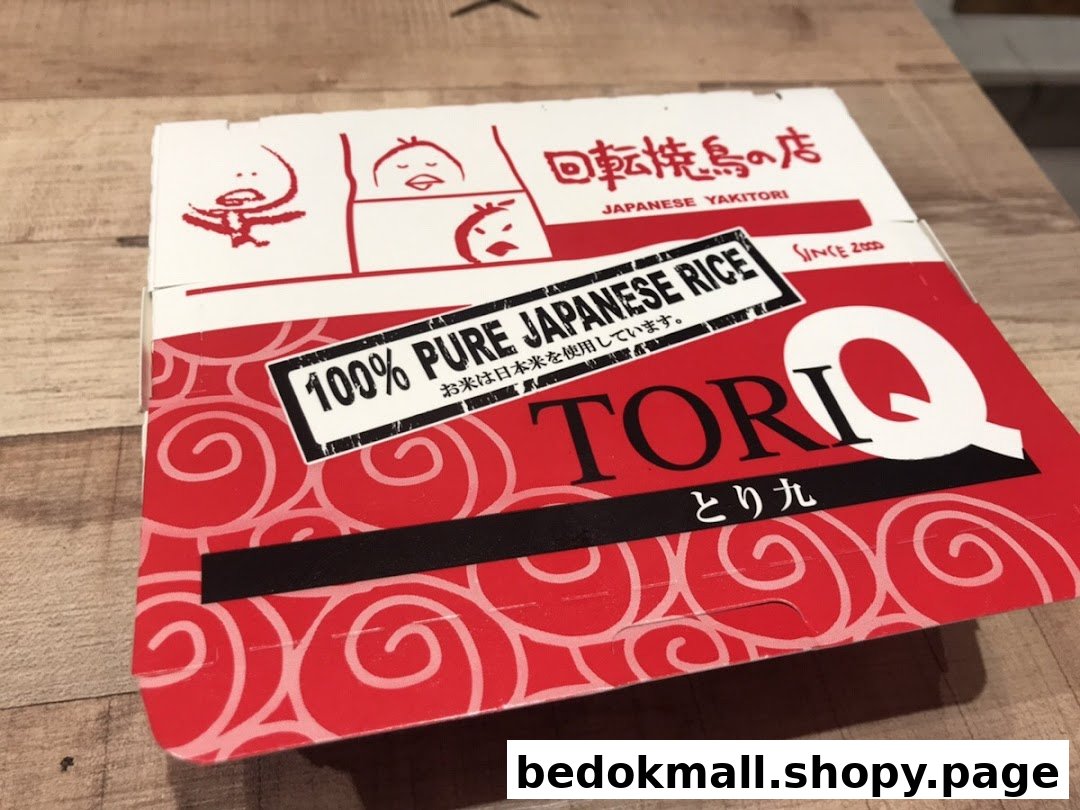 Red and white takeaway box for Tori-Q Japanese Yakitori.