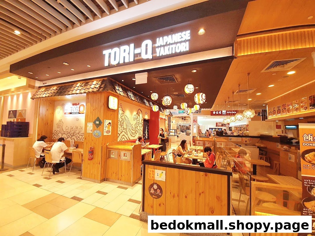 Interior view of Tori-Q Japanese Yakitori shop in a mall with customers.