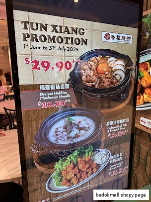 A promotional menu board displaying various food dishes with prices.