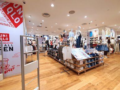 Interior view of a UNIQLO clothing store with mannequins and product displays.