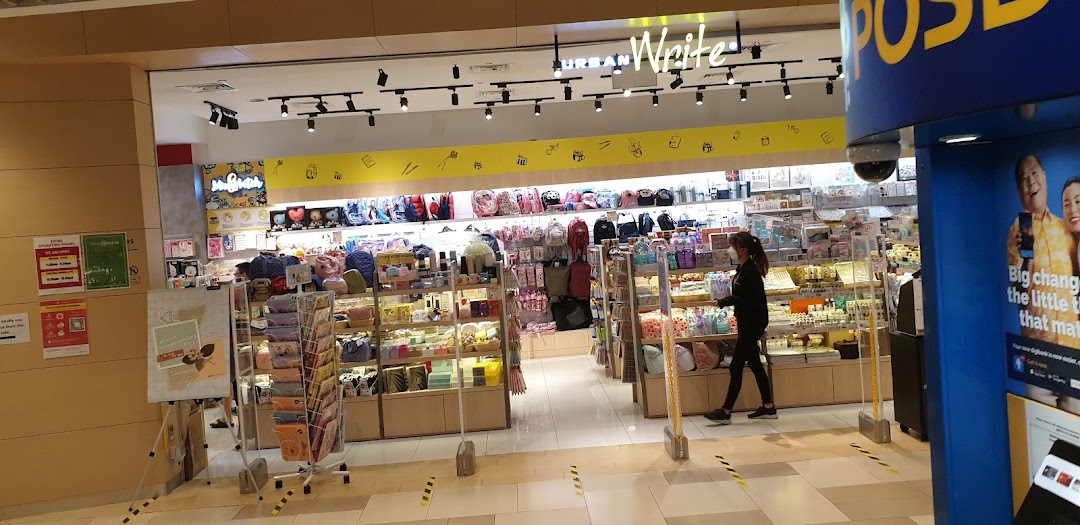 Shop entrance with products and a person inside UrbanWrite.