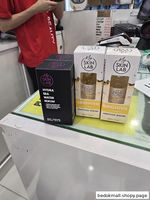 Cosmetic products displayed on a counter inside a beauty shop.
