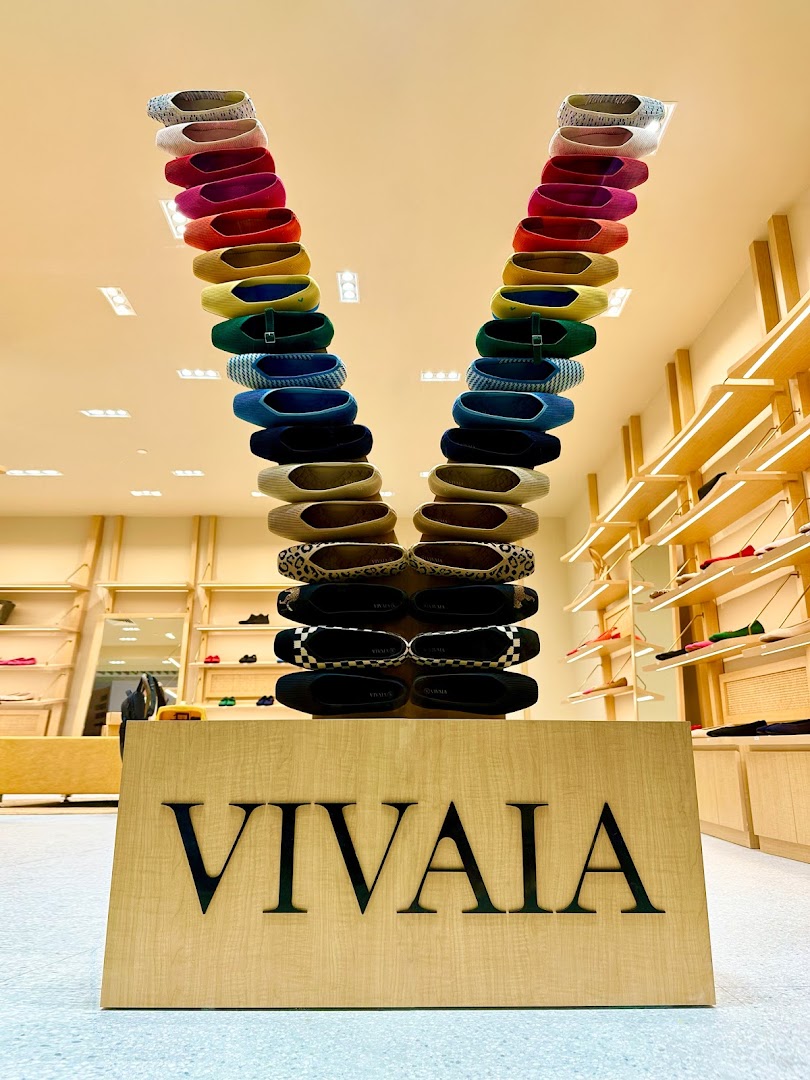 Interior shot of VIVAIA shop with a V-shaped shoe display.