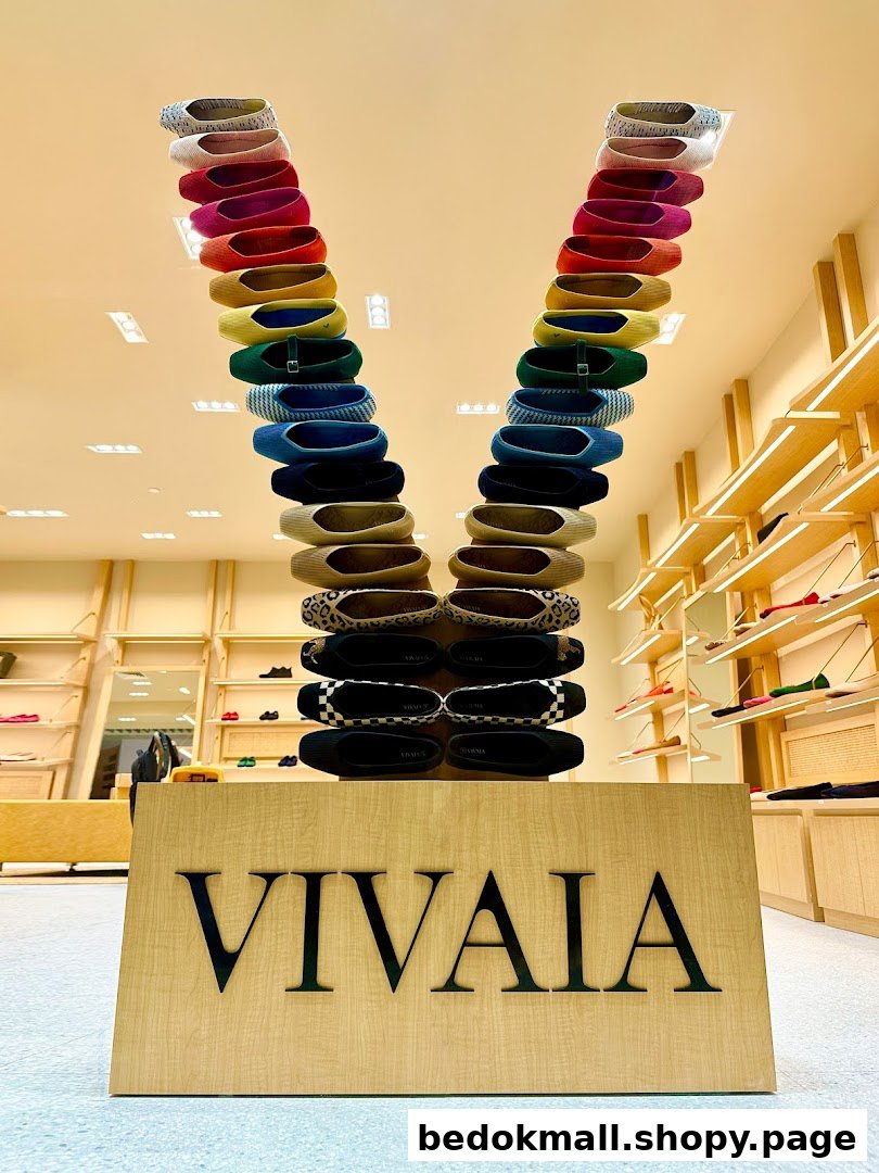 Interior shot of VIVAIA shop with a V-shaped shoe display.