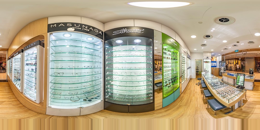 Interior view of an optical shop with numerous eyeglasses and sunglasses on display.