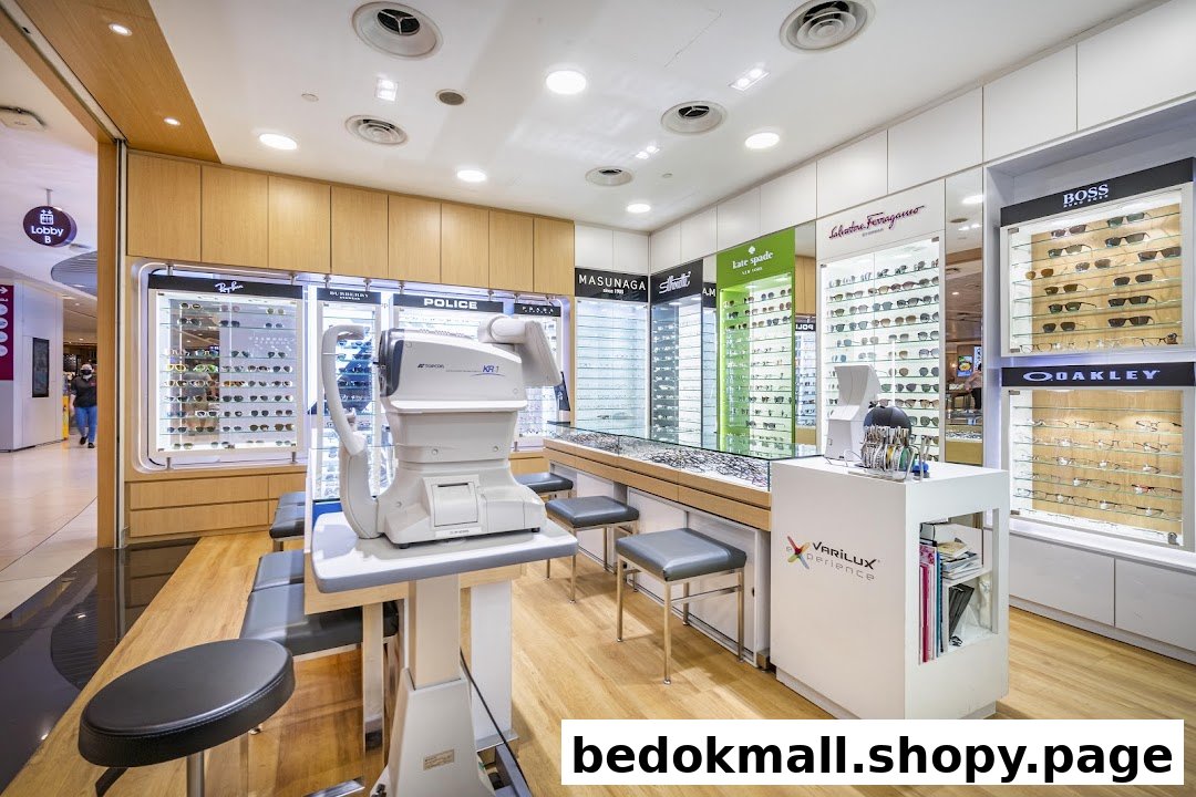 Interior of an optical shop with display cases and eye examination equipment.
