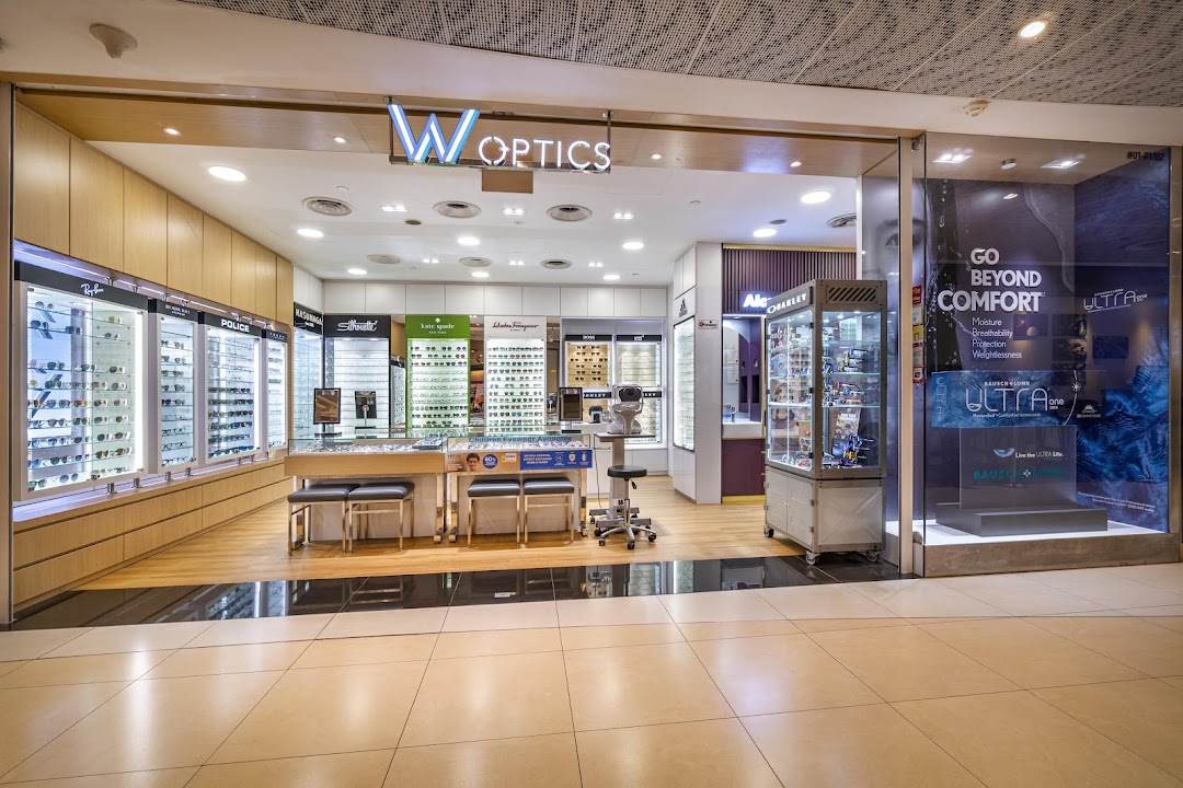 Entrance of W Optics, an optical shop displaying glasses and promotional materials.