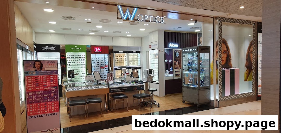 W Optics storefront showing optical displays and entrance in a mall.
