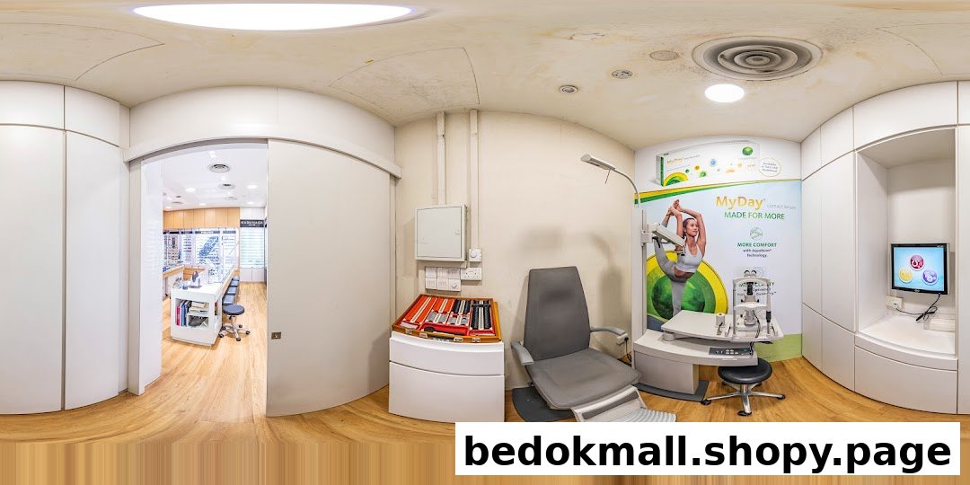 Interior view of an optical shop's examination room with equipment and retail area.