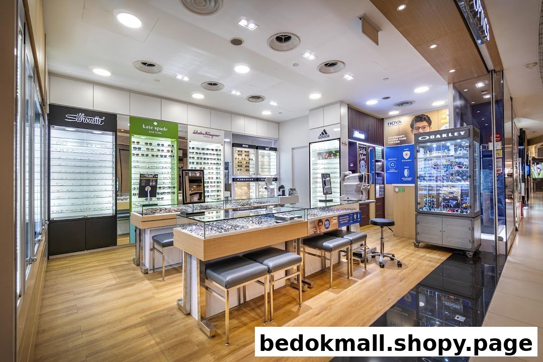 Interior of an optical shop with various glasses displays and eye examination equipment.