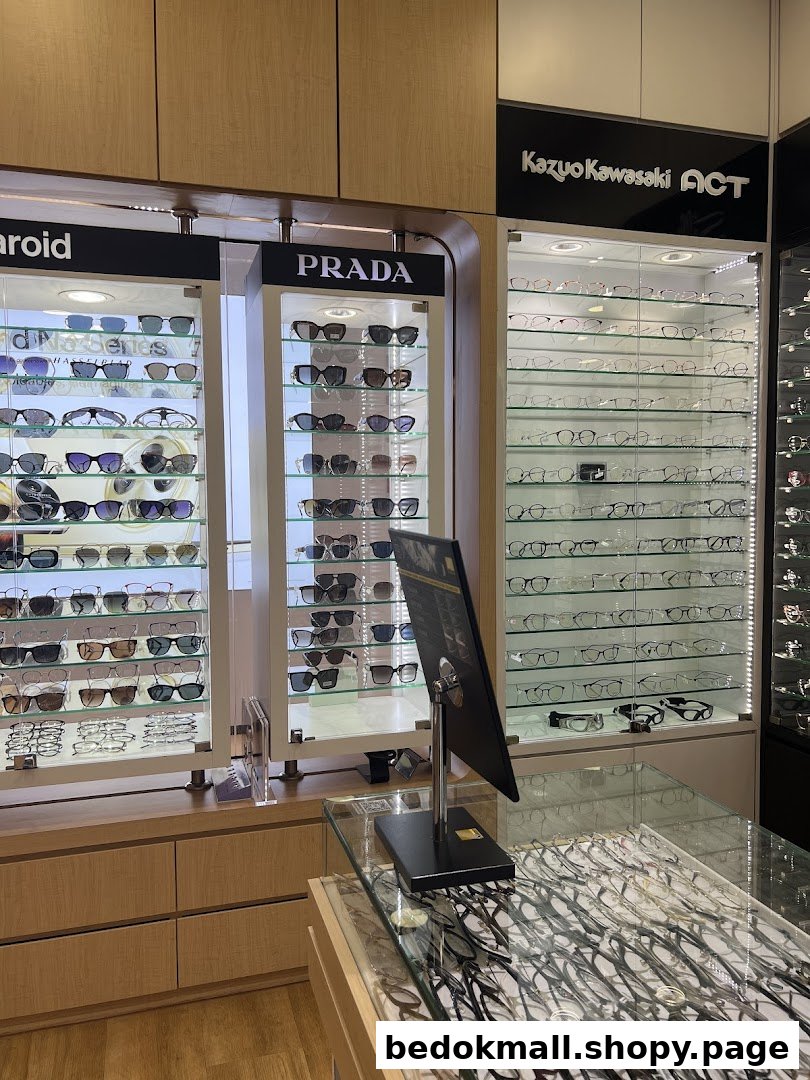 Eyeglasses and sunglasses displayed inside an optics retail store.
