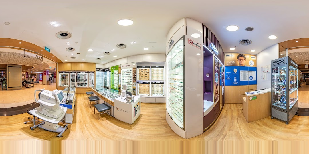 Inside an optical store showing displays, equipment, and reception.