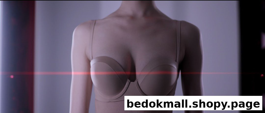 Mannequin or person wearing a beige bra with a red light streak.