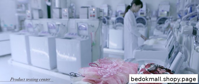 Interior shot of a product testing center with a person and machinery.