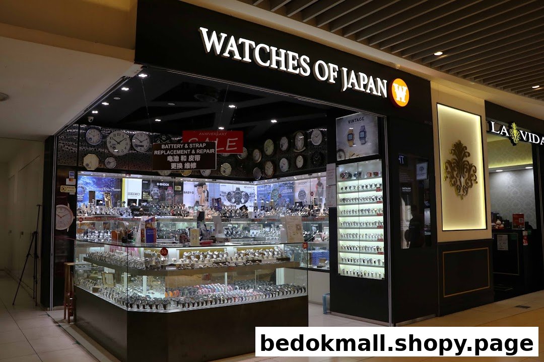 Exterior view of 'Watches of Japan' shop with display cases and signage.