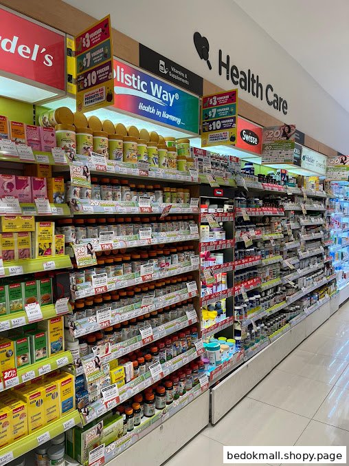 A retail aisle displaying health care products, vitamins, and supplements on shelves.