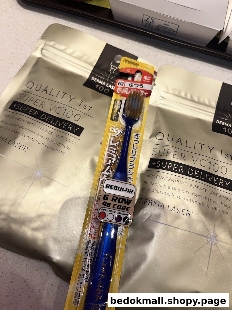 Close-up of a packaged toothbrush and two skincare pouches.