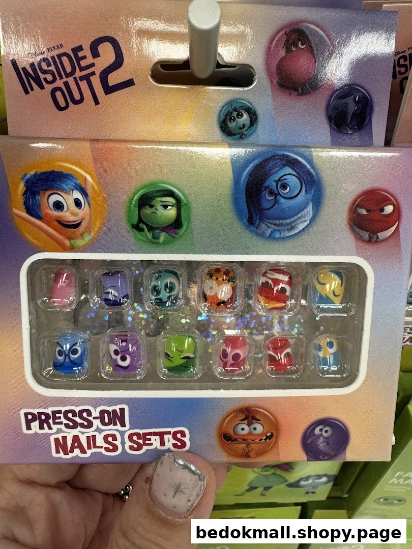 Close-up of Inside Out 2 press-on nails product packaging on a retail shelf.