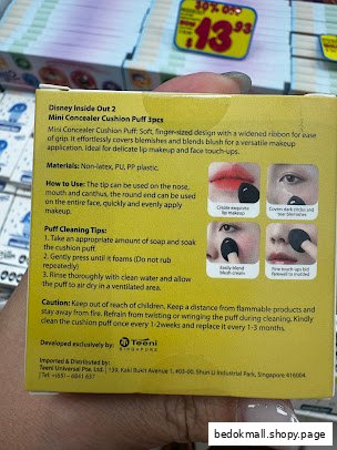 Close-up of a product box with usage instructions and a price tag.
