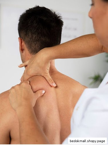 A person receiving a shoulder and neck massage from a therapist.