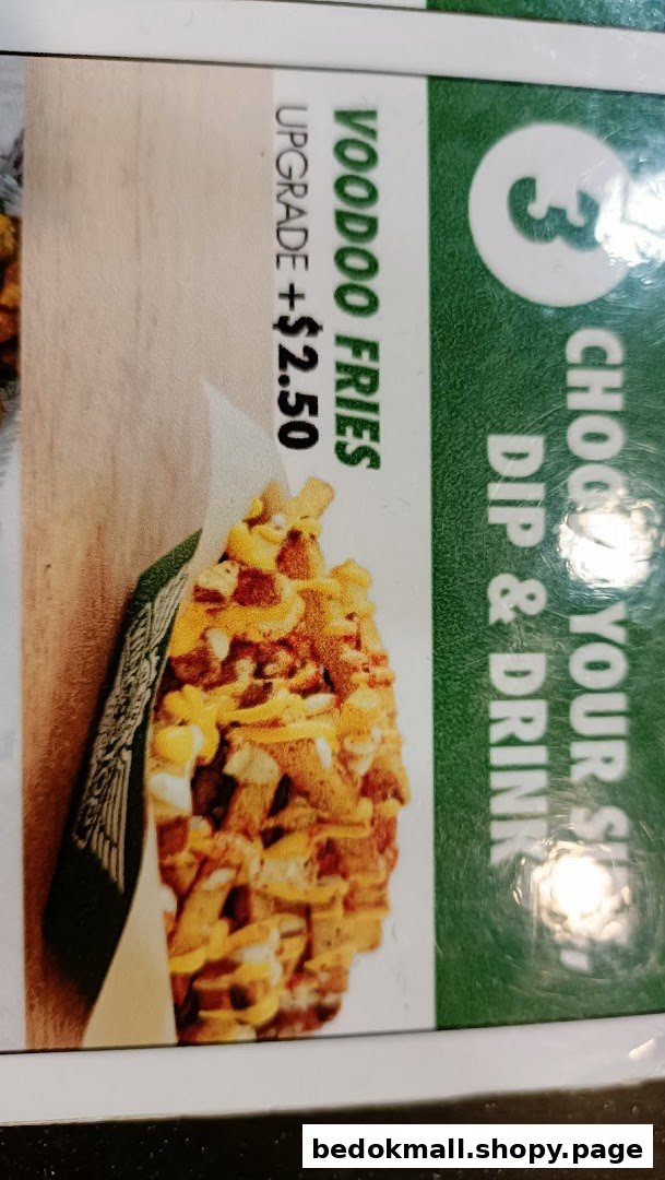 Close-up of a menu board showing Voodoo Fries with an upgrade price.