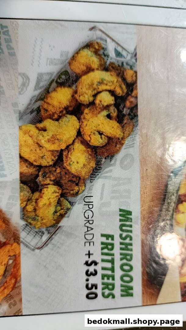 A close-up of Wingstop's menu board featuring crispy Mushroom Fritters as an upgrade option.
