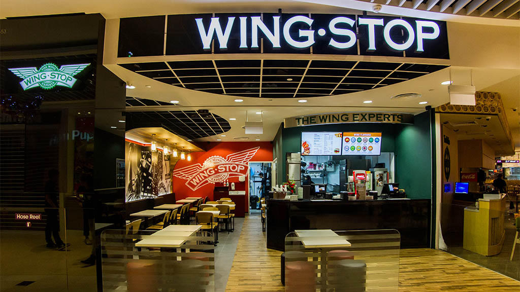 Wingstop shop front with visible interior seating and counter.