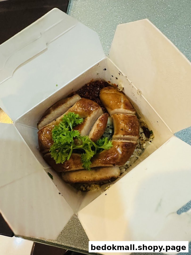 A white takeout box filled with food, topped with sliced meat and green herbs.