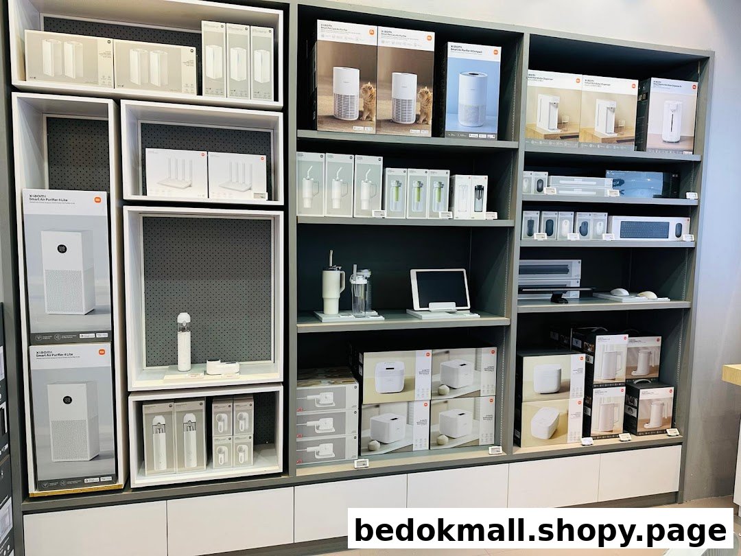 A retail display shelf showcasing various Xiaomi electronic products and their packaging.