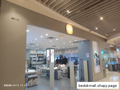 Entrance to a Xiaomi store in a mall, showing interior displays.