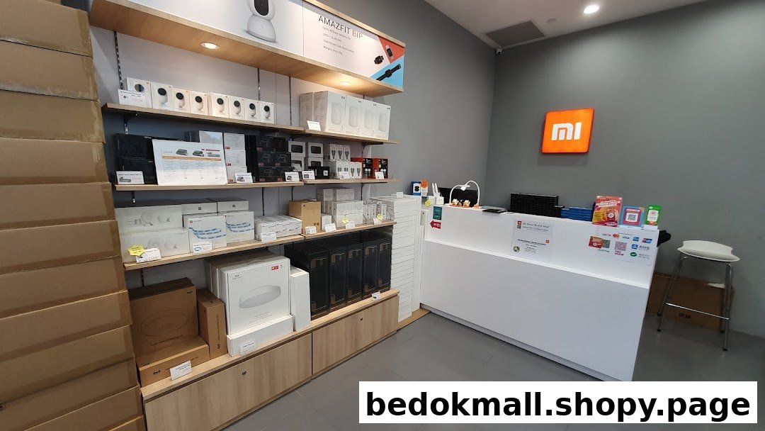 Inside a Xiaomi store showing product displays, boxes, and a service counter.