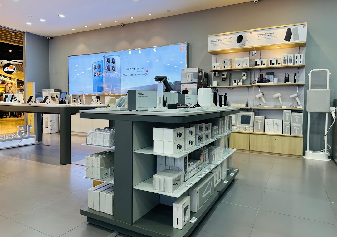 Interior view of a Xiaomi store with various electronics on display.