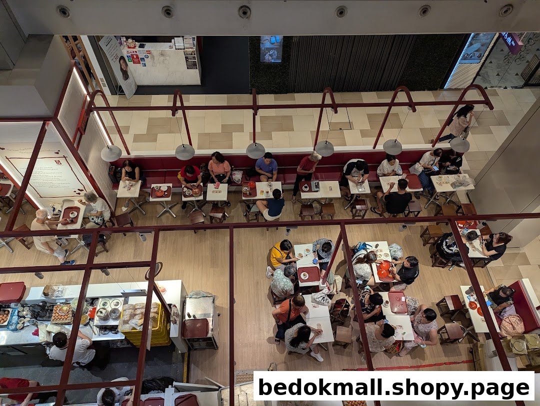 Overhead view of a busy cafe interior with many customers dining.