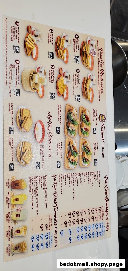 A detailed menu board displaying various food and drink items with prices.