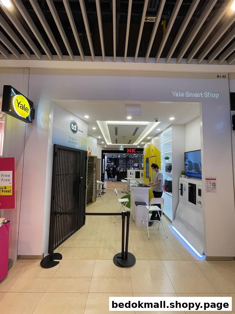 Entrance of Yale Smart Shop with a person inside and a barrier.