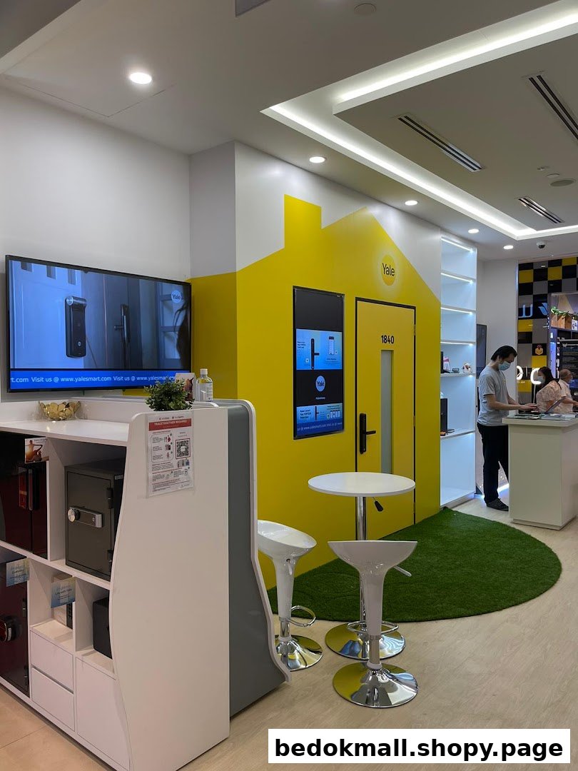 Interior of a Yale Smart Shop with product displays, interactive screens, and staff.