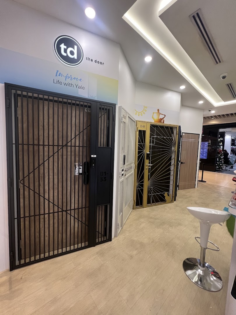 Interior view of a shop displaying various security gates and doors.