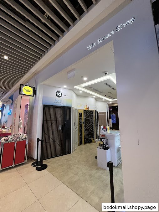 Entrance of Yale Smart Shop displaying security gates and doors.
