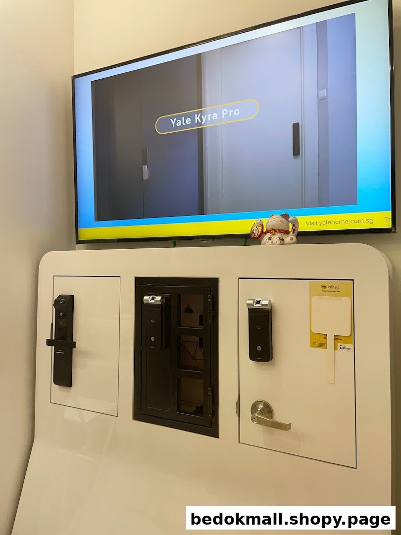 Interior display of Yale smart locks with a product video playing on a screen.