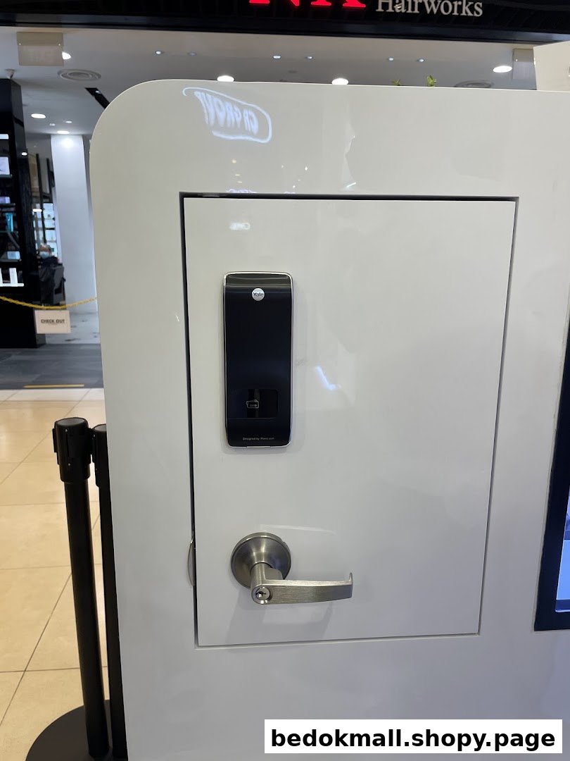 White display stand showcasing a Yale smart lock and door handle.