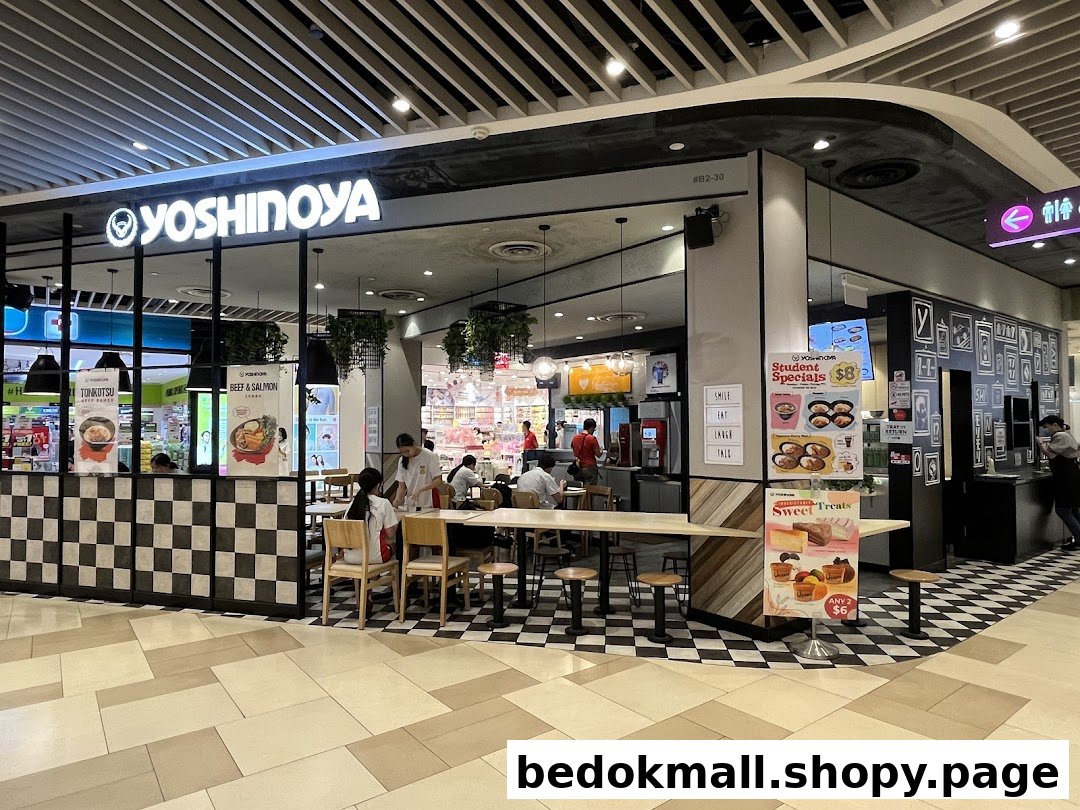 Yoshinoya restaurant storefront with signage and visible interior in a mall.
