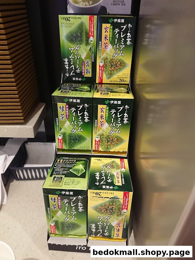 Boxes of Ito En premium tea bags displayed on a stand.