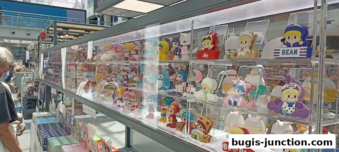 A display case filled with various collectible figurines and toys.